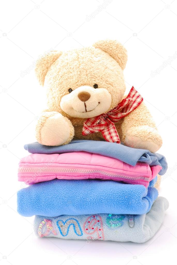 Teddy bear stack of kids clothes