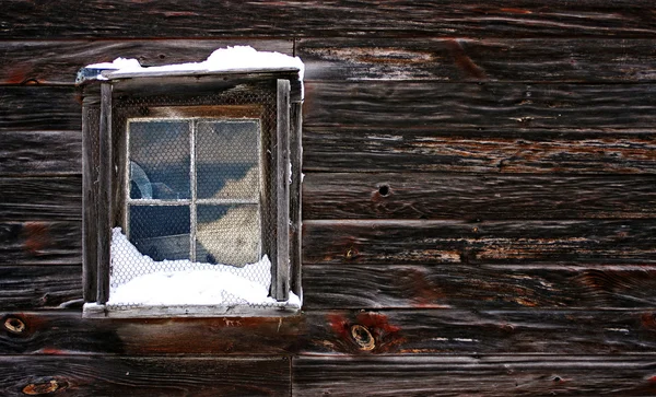 Sneeuw bedekte venster Rechtenvrije Stockfoto's