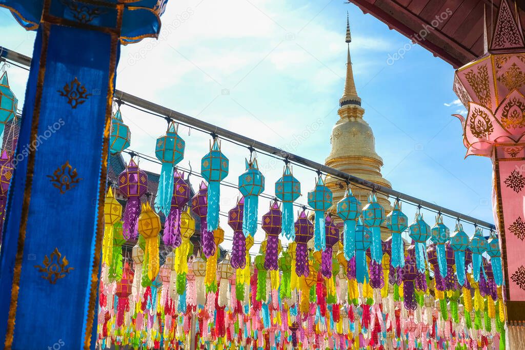 Traditional paper lanterns hanging on the rows in Wat Phra That Hariphunchai, Lamphun province of Thailand during Yi peng (or Yee peng) festival.