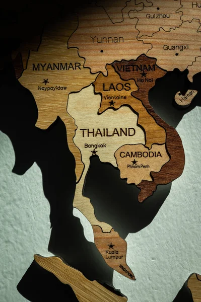 Close up of Southeast Asia countries (such as Thailand, Cambodia, Myanmar, Laos etc) on wooden world map on the wall.