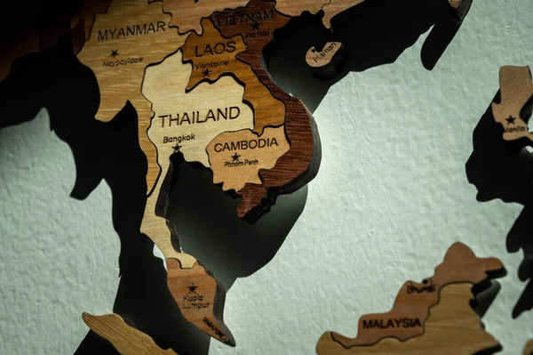 Close up of Southeast Asia countries (such as Thailand, Cambodia, Myanmar, Laos etc) on wooden world map on the wall.