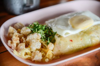 Close-up of Khao Pun Phak and iconic and local unique food of Laplae district in Uttaradit province of Thailand. (Steamed vegetables and minced meat wrapped in rice flour skin)