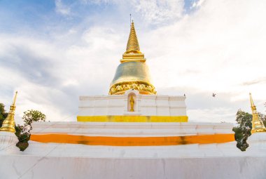 Wat Phra Borom That Thung Yang the most important pagoda in Laplae district of Uttaradit Province of Thailand at sunset.