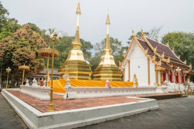Wat Phra That Doi Tung an iconic twin ancient pagoda on Doi Tung mountain of Chiang Rai province of Thailand in winter season.