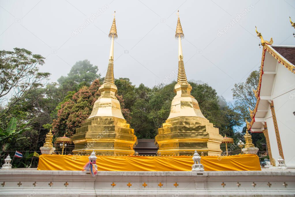 Wat Phra That Doi Tung an iconic twin ancient pagoda on Doi Tung mountain of Chiang Rai province of Thailand in winter season.