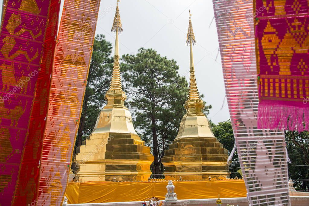 Wat Phra That Doi Tung an iconic twin ancient pagoda on Doi Tung mountain of Chiang Rai province of Thailand in winter season.