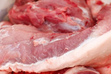 Defocus texture or background of tasty fresh meat of big, pork. Red beef meat close up texture. Meat food background. Blurred. Fresh meat. Ukrainian salo. Out of focus.