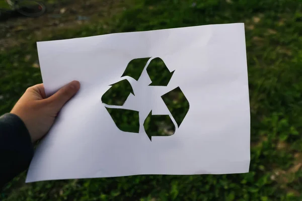 Defocus Hand Holding Cut Paper Logo Green Grass Nature Trash — Stock Fotó