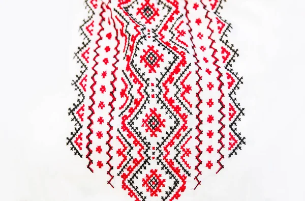 Defocus emboidery ukrainian pattern background. Ukrainian ornament. Ornaments embroidered on clothes. Ukraine embroidered on a white background. Out of focus.