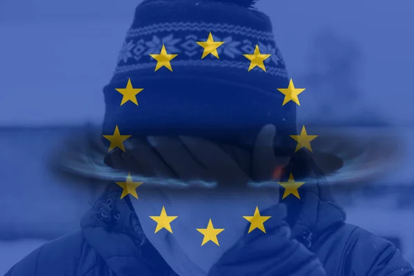Defocus European Union flag. Energy prices. Cold winter season. Power problem. Energy crisis in Europe. War sanctions. Russia dependence. Snowing weather. Expensive gas. Out of focus.