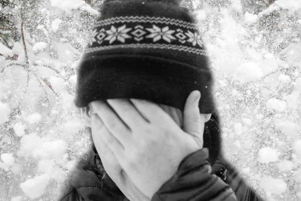 Defocus sad winter man. Energy prices. Cold winter season. Power problem. War sanctions. Christmas. Snowing weather. Poverty. Blurred man depression. Snowy cold winter. Out of focus.
