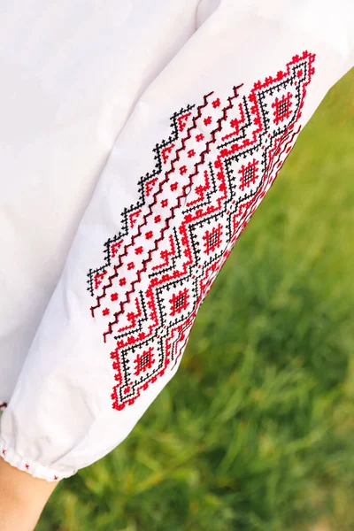 Defocus emboidery ukrainian pattern background. Ukrainian ornament. Ornaments embroidered on clothes. Ukraine embroidered on a white background. Vyshyvanka sleeve. Out of focus.