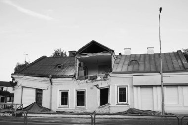 Defocus huge ruins, wreck in Ukraine, war. House after russian attack. Ruined home background. Kyiv home. Close-up. Russian terrorism. Black and white. Out of focus.