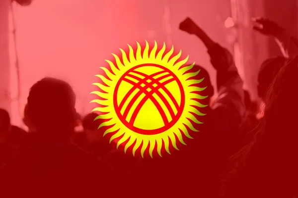 Defocus protest in Kyrgyzstan. Conflict war between Kyrgyzstan and Tajikistan over border. Conflict. Country flag. Out of focus.