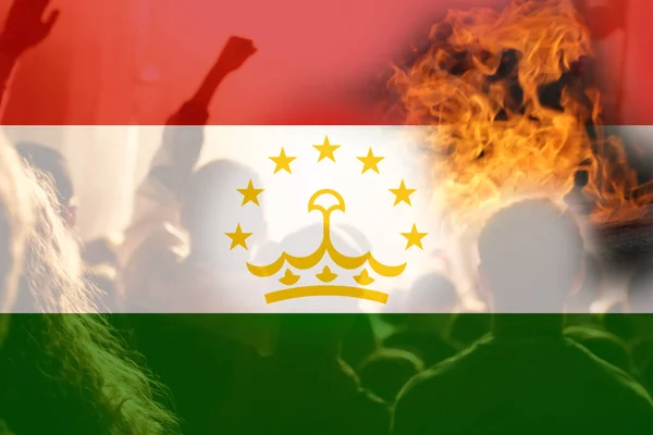 Defocus protest in Tajikistan. Conflict war between Kyrgyzstan and Tajikistan over border. Conflict. Country flag. Fire, flame. Out of focus.