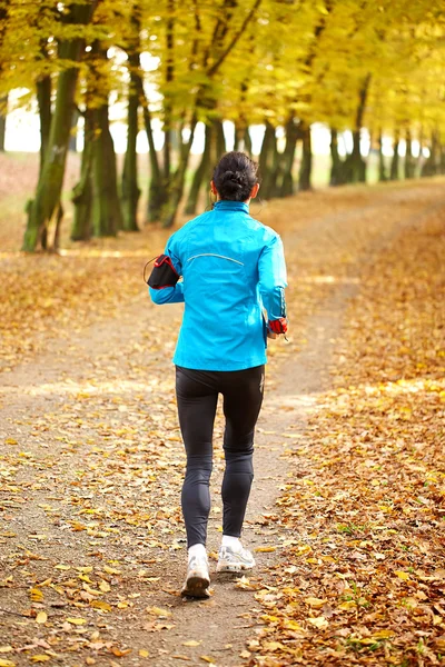 Female jogger in the park — Stock Photo, Image