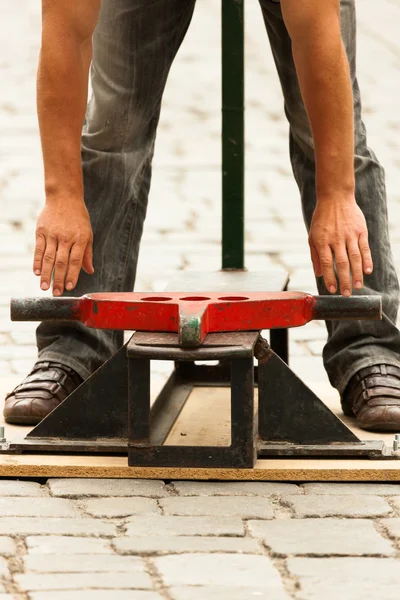 Stongman performing on streets — Stock Photo, Image