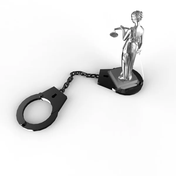 Фемида статуя и наручники — стоковое фото