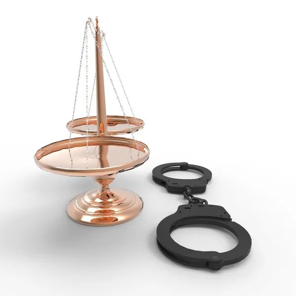 Scales of justice and handcuffs — Stock Photo, Image