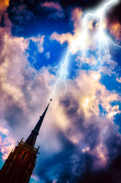Stormy clouds over church — Stock Photo, Image