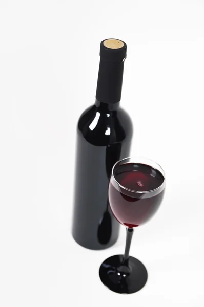 Bottle of red wine with a glass — Stock Photo, Image