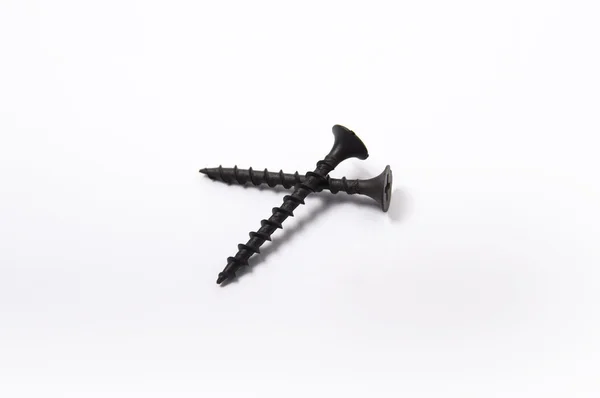 Black screws on white backgrond — Stock Photo, Image