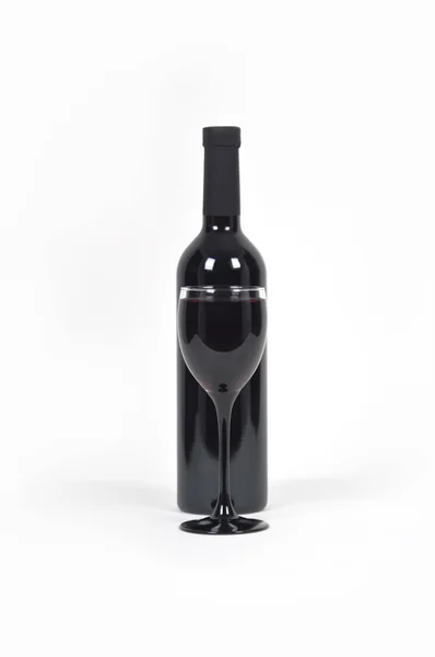 Bottle of red wine with a glass — Stock Photo, Image