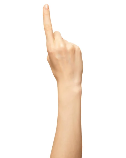Жіноча рука показує номер один палець ізольовано на білому. Палець для підрахунку жестів, переліку — стокове фото