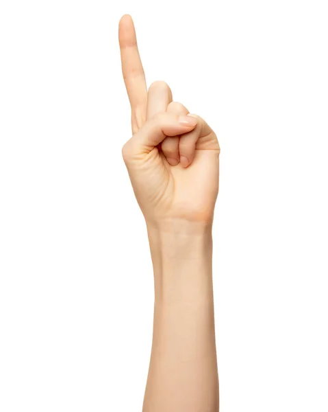 女性の手は白に隔離されたナンバーワンの指を示しています。ジェスチャー、列挙を数えるための額 ロイヤリティフリーのストック写真