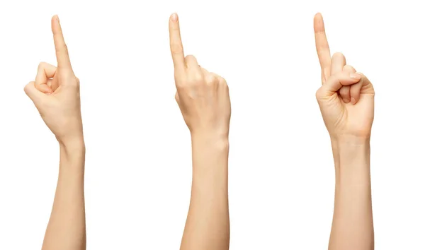 女性の手は白に隔離されたナンバーワンの指を示しています。ジェスチャー、列挙を数えるための額 ストック写真