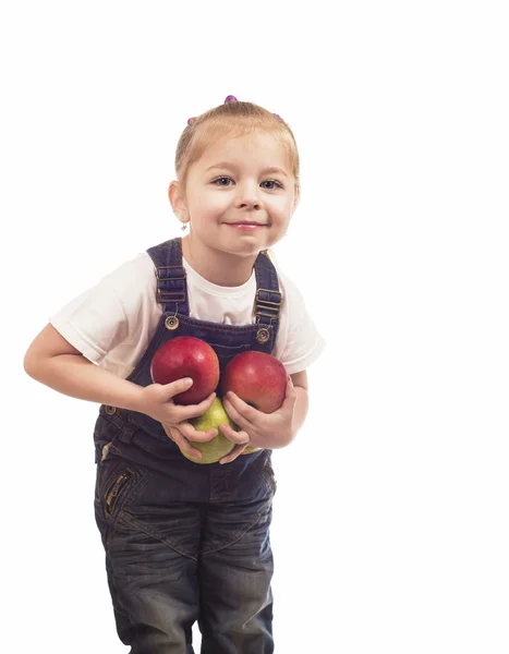 Holčička hraje s jablky — Stock fotografie