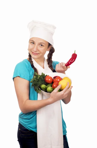 Chica cocinero y productos sobre fondo blanco — Foto de Stock