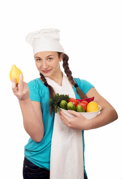 Chica cocinero y productos sobre fondo blanco — Foto de Stock