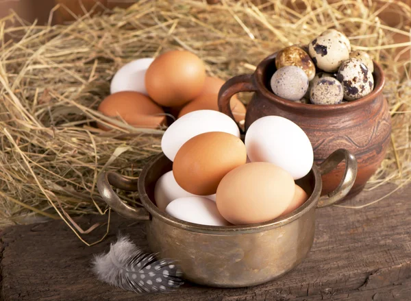 Eggs on old wooden background — Stock Photo, Image