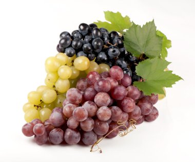 Black, green, red bunch of grapes close up, on white background,