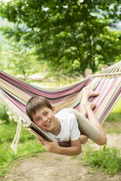 Boy in a hammock on the nature — Stock Photo, Image