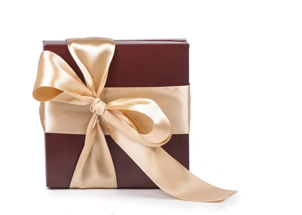 Box with candies and golden tape — Stock Photo, Image