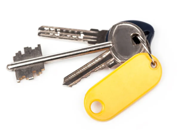 Key with blank golden label — Stock Photo, Image