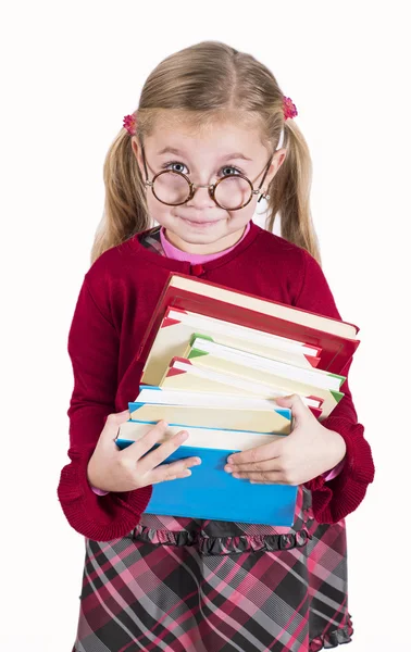 Niña sostiene libros —  Fotos de Stock