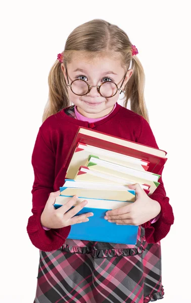 Little girl holds books Royalty Free Stock Photos