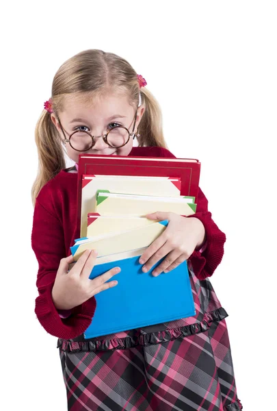 Niña vistiendo gafas sostiene libros — Foto de Stock