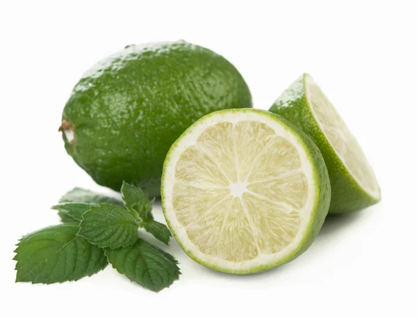 Fresh limes, mint leaves — Stock Photo, Image