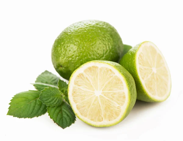 Fresh limes, mint leaves — Stock Photo, Image