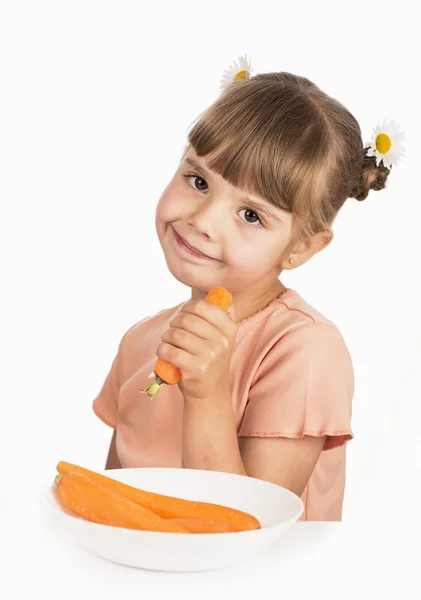 Girl with carrots — Stock Photo, Image