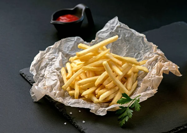 Pile French Fries Placed Food Oil Blotting Paper Black Plates — Stock Photo, Image