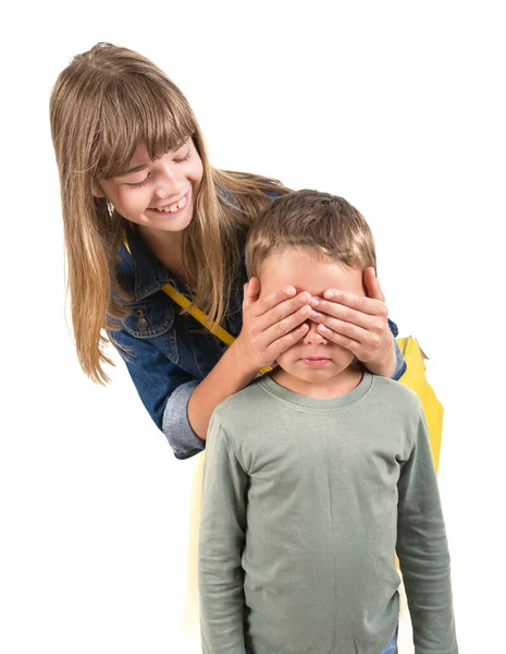 Teen Boy Covering Girls Eyes Surprise Her Portrait Brother Sister — Stock Photo, Image