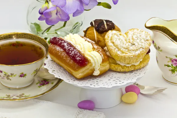 stock image Cream tea with cakes and china cup.