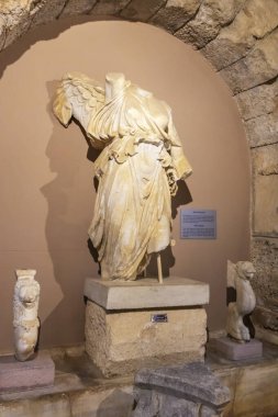 Side, Turkey - November 6, 2021: Winged statue of the Greek goddess Nike (Roman period) in the Side Archaeological Museum.