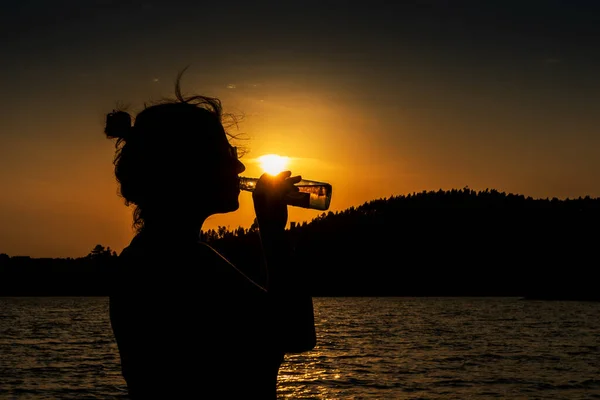 Silhouette Woman Drinking Golden Beverage Sunset — Stock Photo, Image