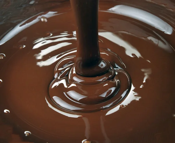 Lots of chocolate falling from above — Stock Photo, Image